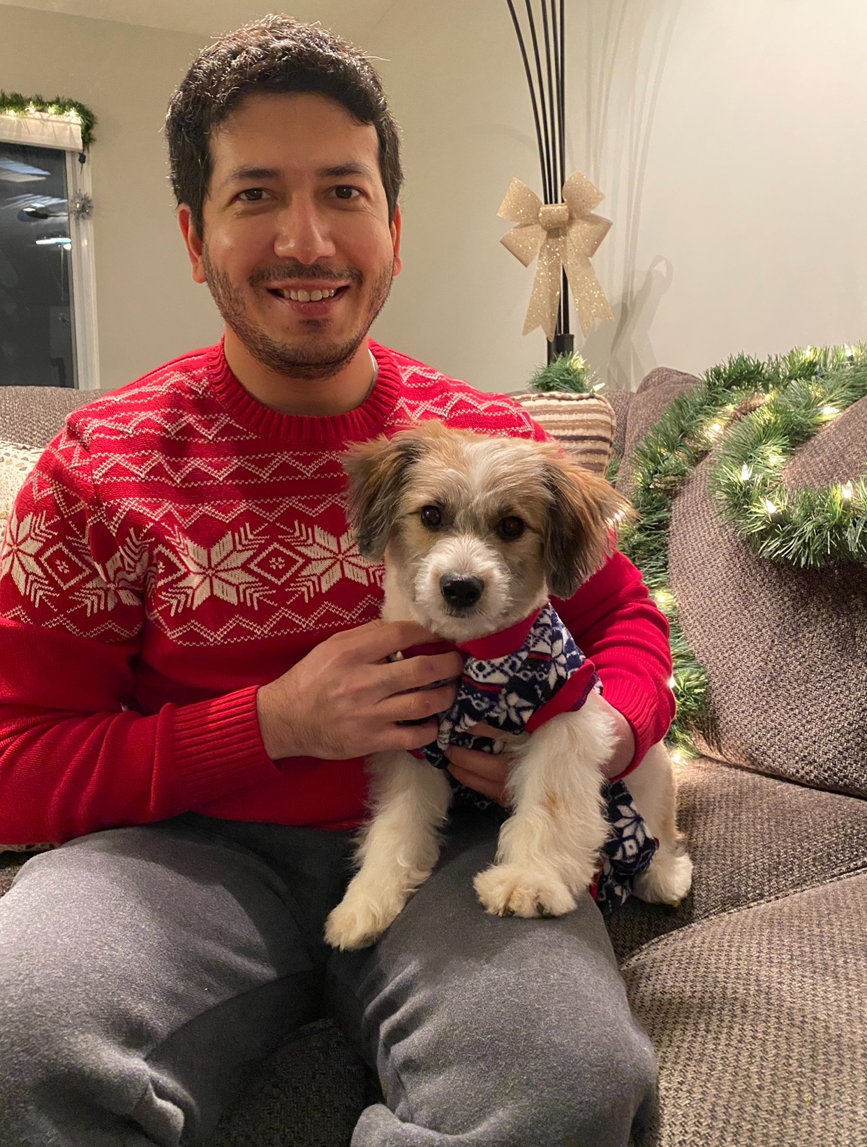 Dr. Sahil Manhas holding Sherlock at Christmas
